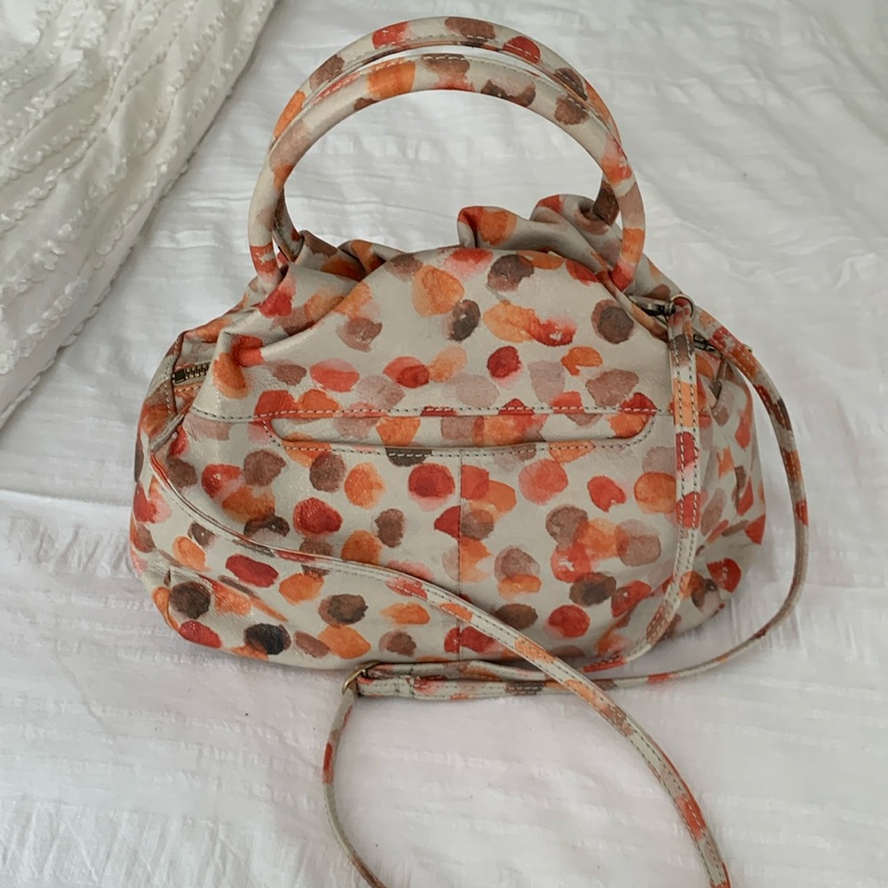 Hobo top zip convertible handbag.